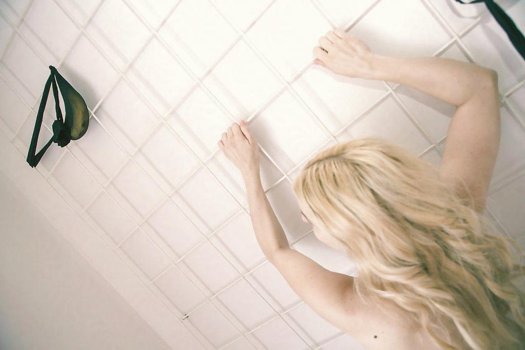 First time blonde hottie hates getting weird with latex in the bathtub Photo