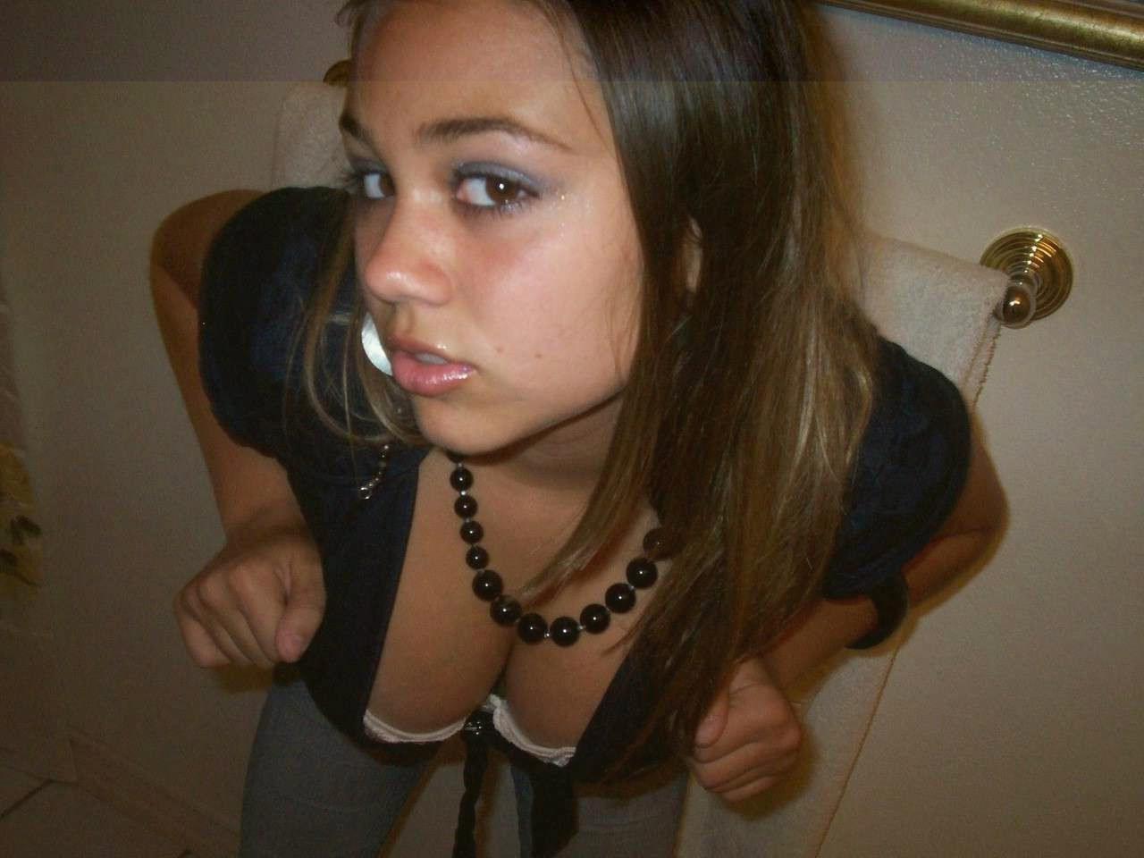 Sweaty Latina girl with beautiful tits shows them off in sexy clothes Photo